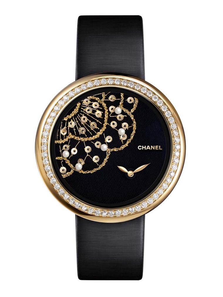 One of three new Chanel Mademoiselle Privé Camellia Brodé Lesage watches, hand embroidered with yellow gold and green silk thread, gold sequins and natural pearls