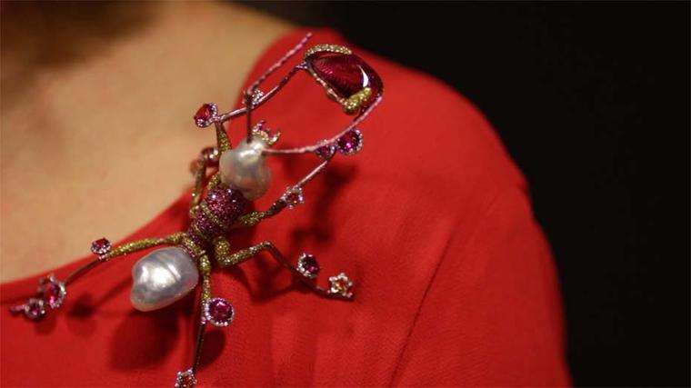 Maria Doulton tries on Wallace Chan's surprisingly lightweight The Mighty brooch featuring a total of 75.94ct of pearls, 21.41ct of rubellite, yellow sapphires, diamonds, pink sapphires and yellow diamonds.