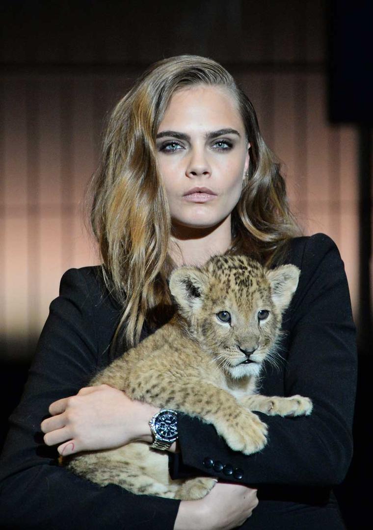Cara Delevingne Poses With A Lion Cub For TAG Heuer