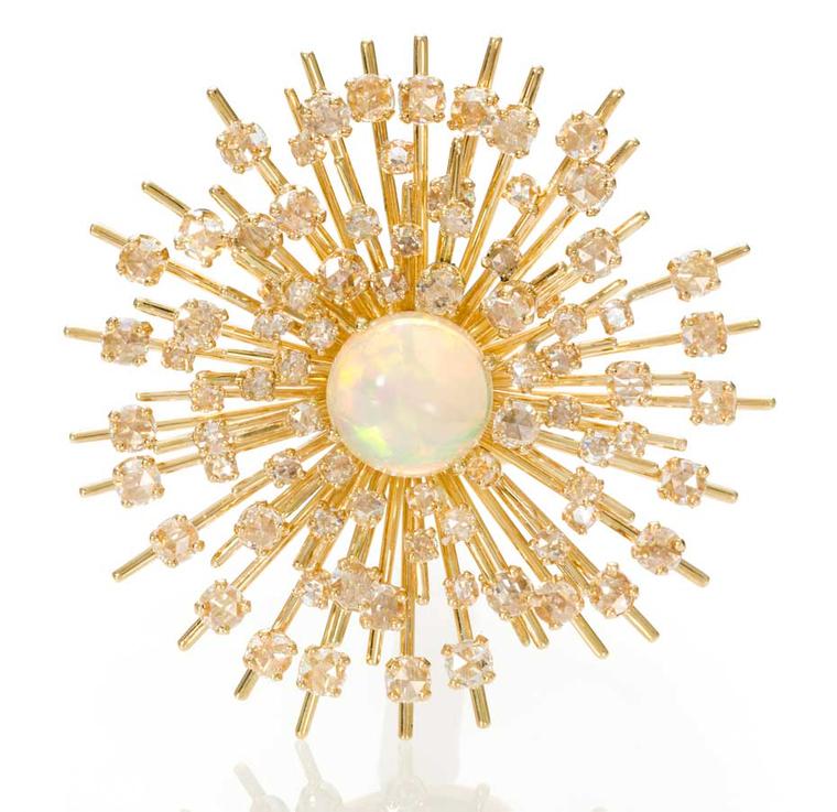 This stunning Starburst opal and diamond ring by Maiyet is set with a circular cabochon opal within a rose-cut diamond and gold starburst mount.