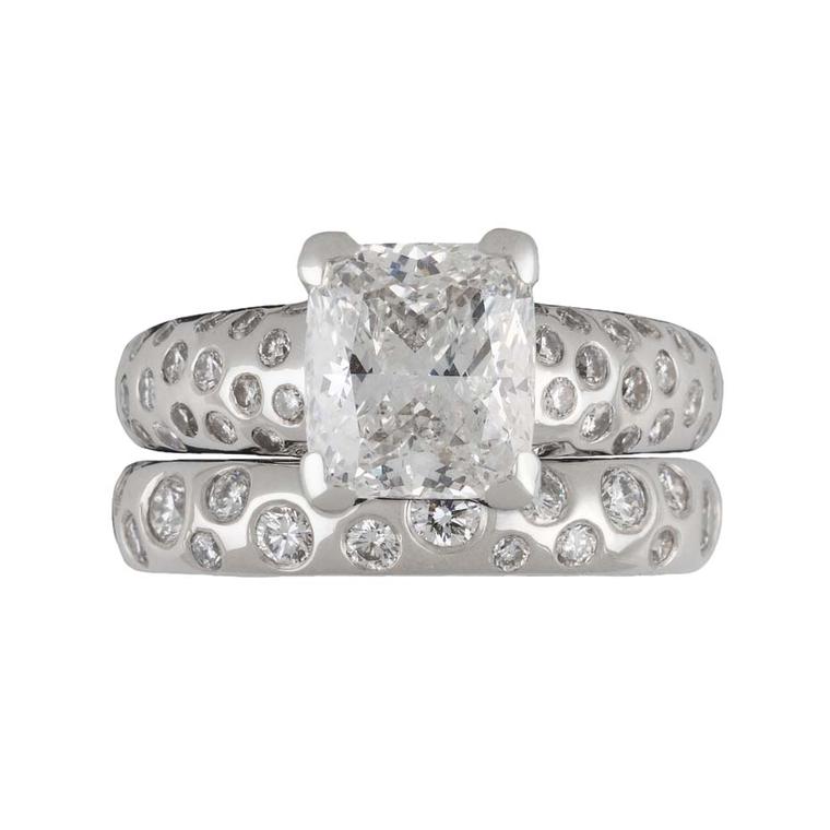 Dower & Hall “Fireworks” engagement ring with a 2.00ct cushion-cut diamond on a platinum band, set with tiny diamonds.