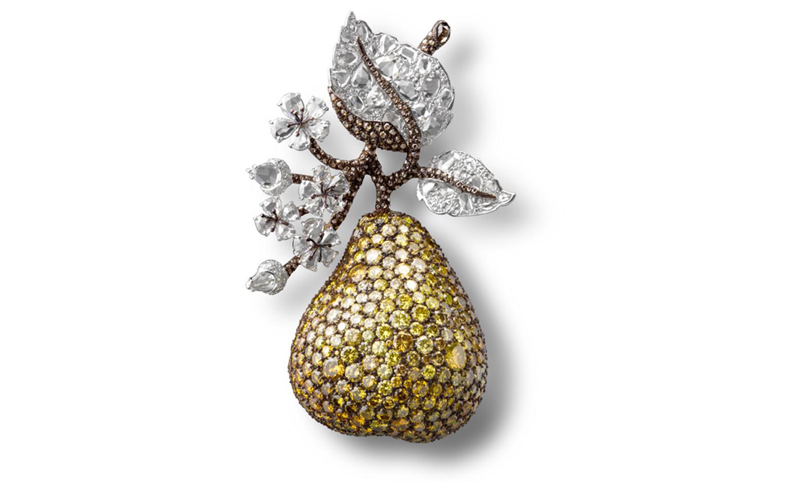 Pear Clip with white, fancy vivid and intense yellow and brown diamonds in platinum and gold.