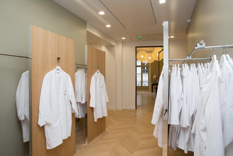 Lab coats for students partaking in L'École Van Cleef & Arpels workshop classes.