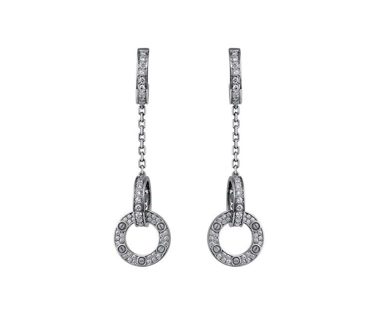 Resembling miniature handcuffs covered in diamonds, the Love drop earrings in platinum and diamonds are a strong statement about your feelings towards your loved one.